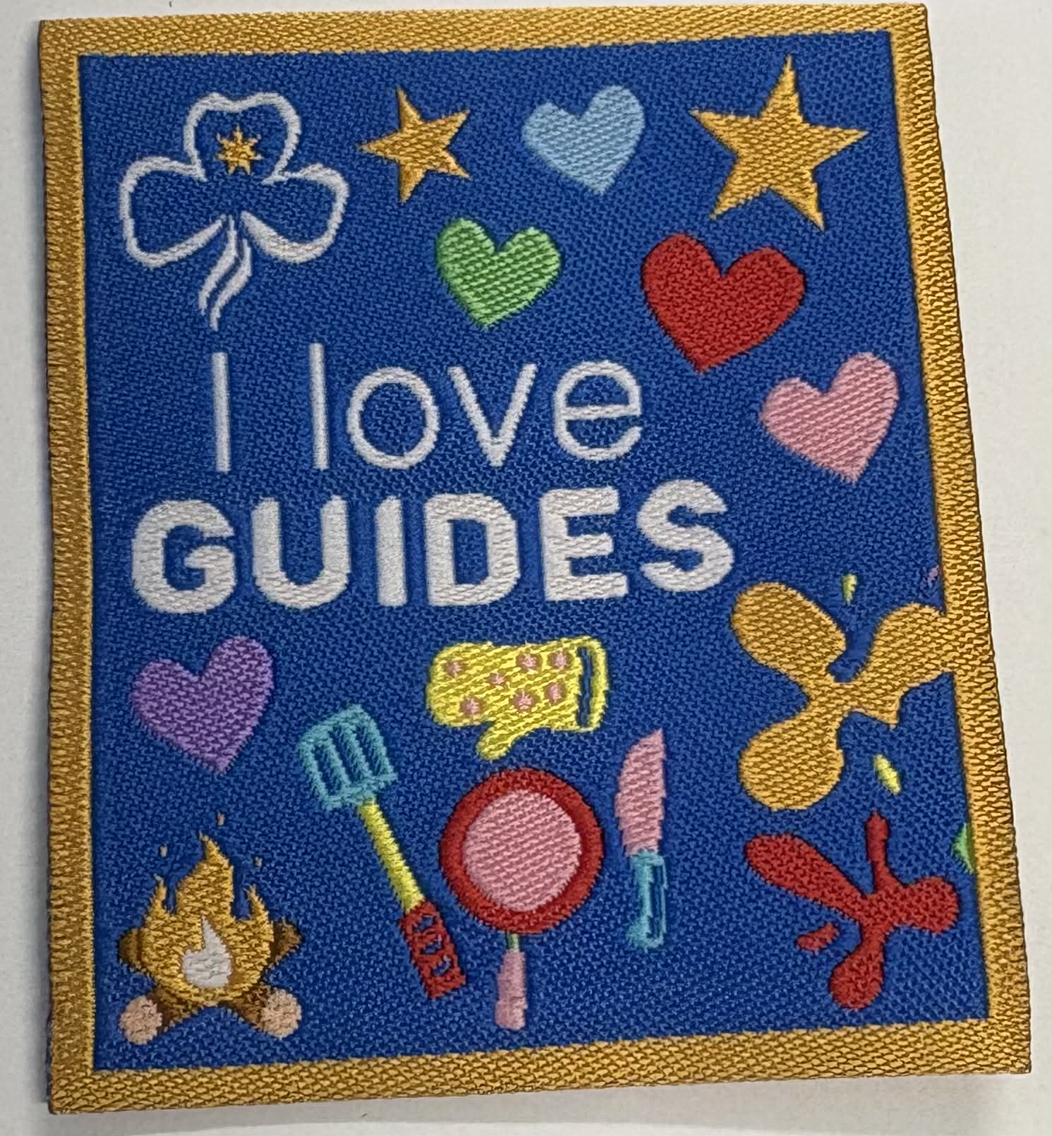 Square unbound badge with colorful icons and 'I love GUIDES' text on a blue background