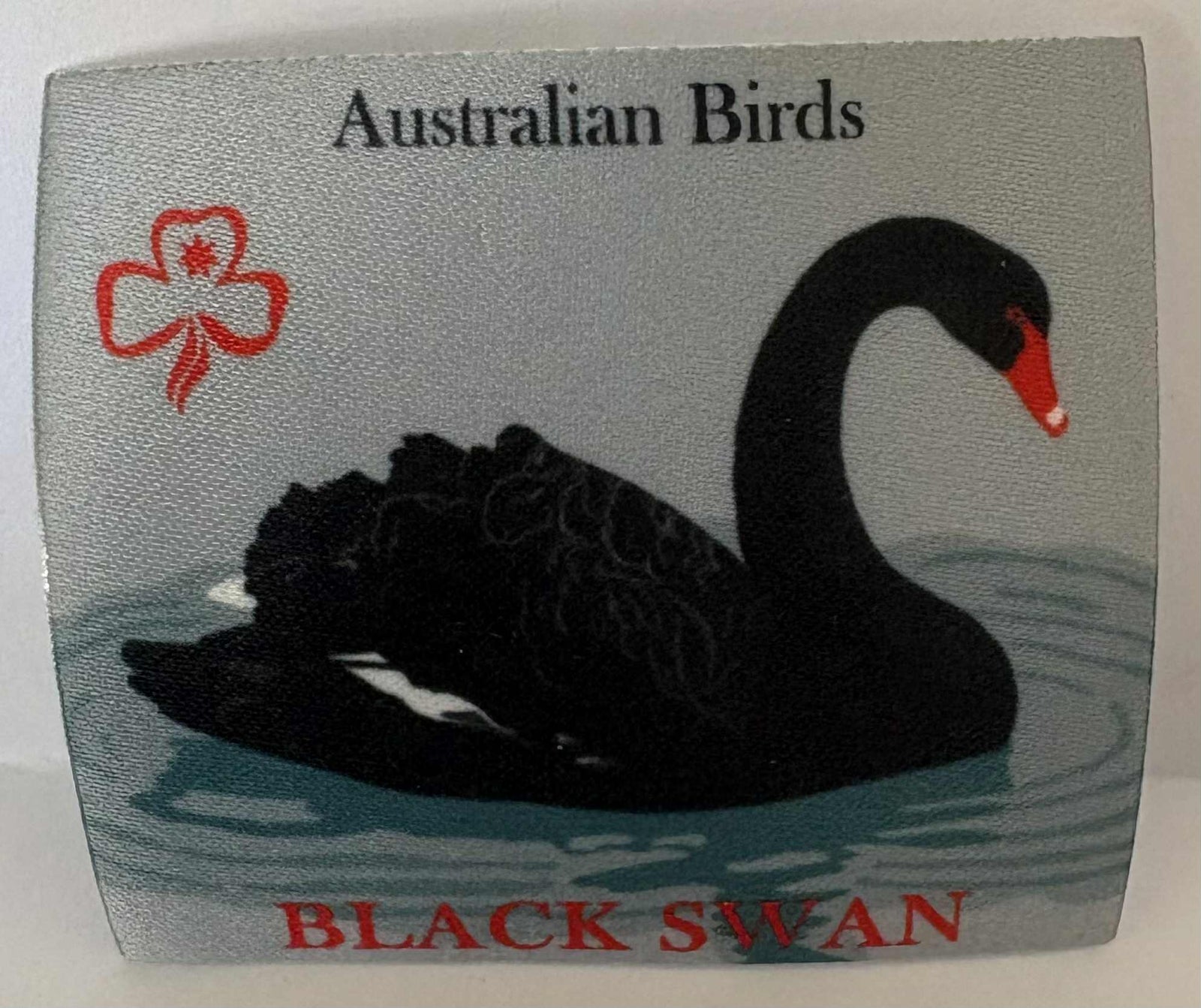 a square unbound badge with a black swan illustration and text 'Australian Birds Black Swan' on a grey background.