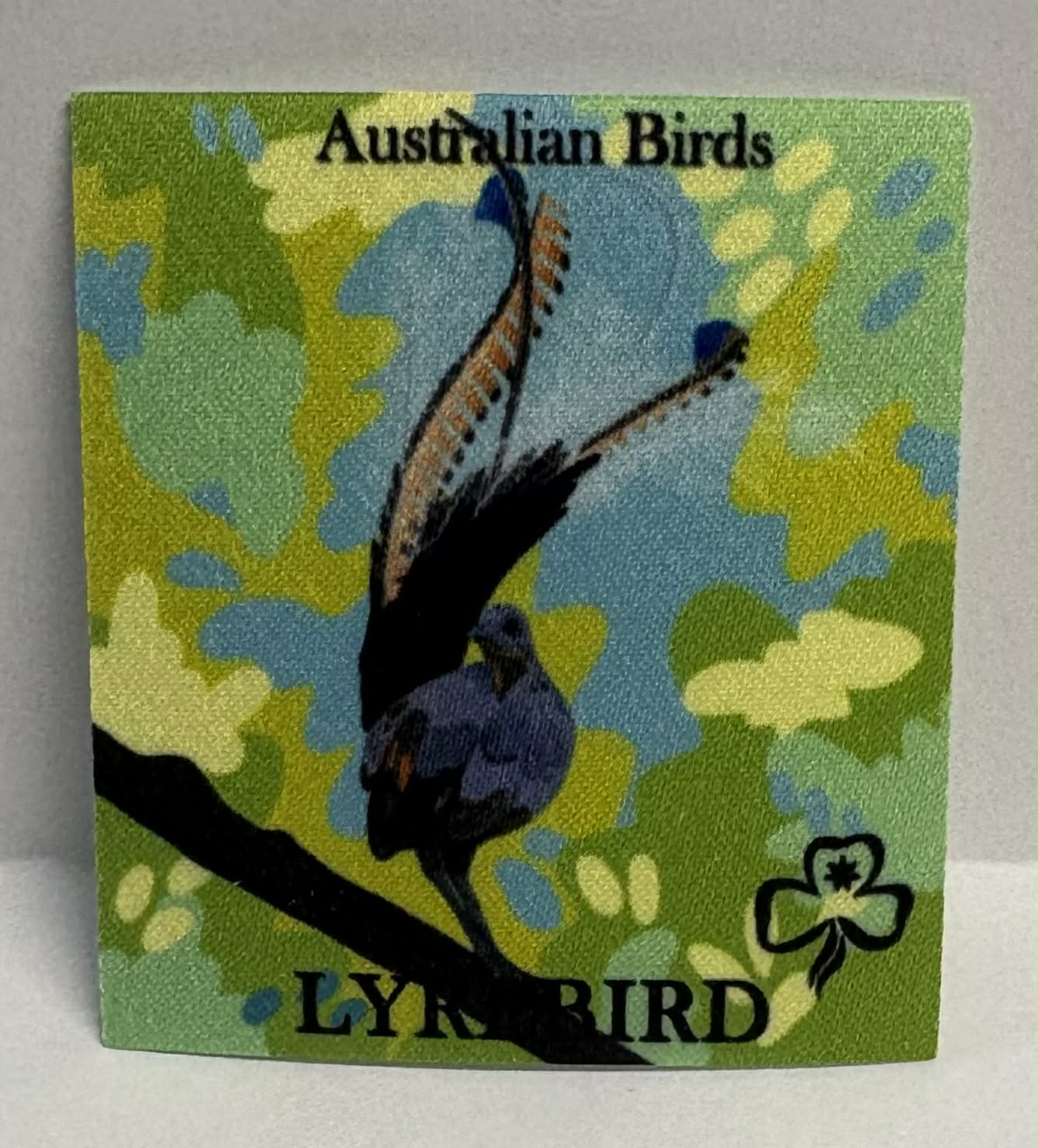 Square unbound badge with a lyrebird illustration on a colorful background with 'Australian Birds' text.