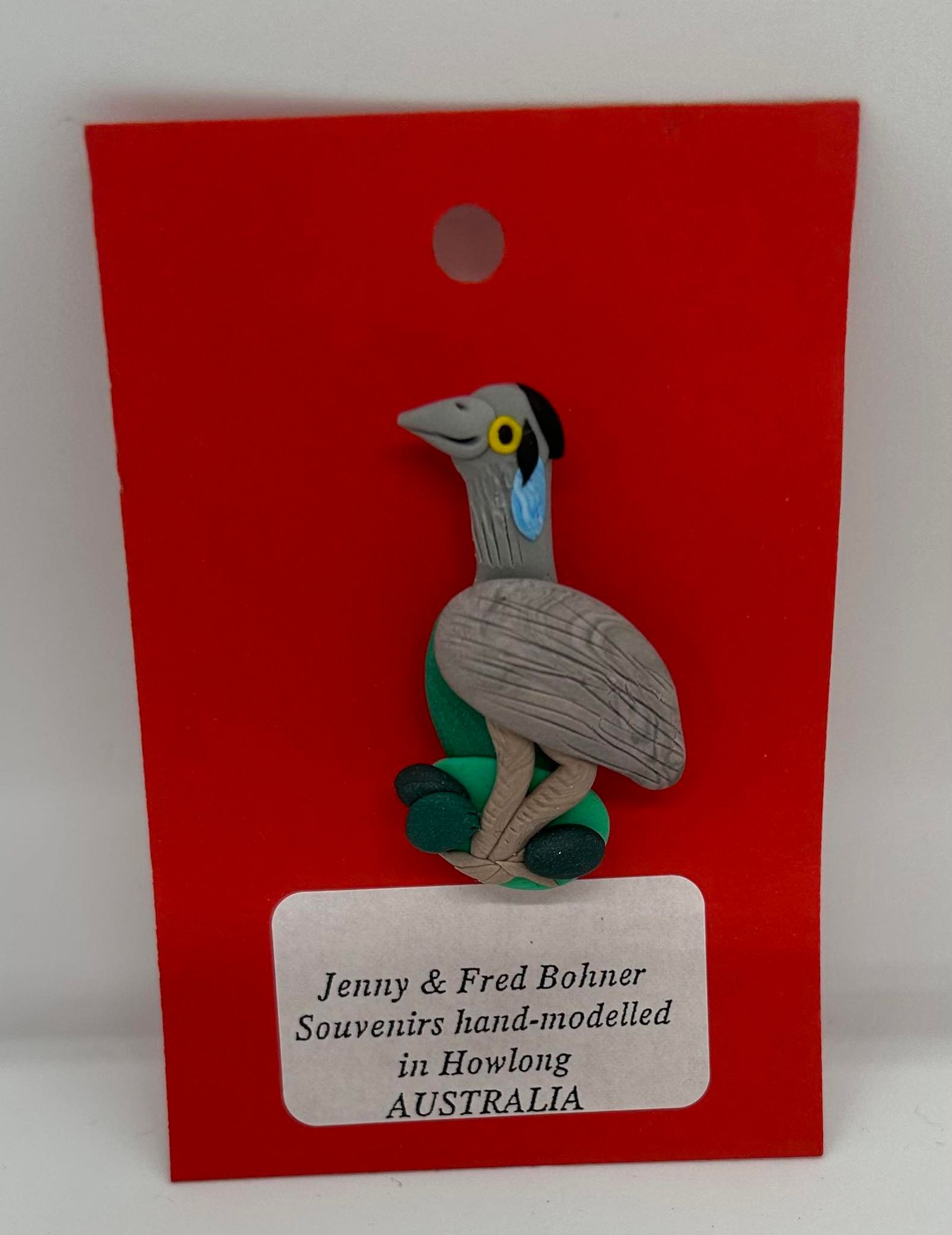 a clay badge of an emu