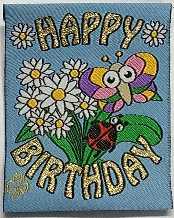 a square unbound blue badge with flowers and a ladybug and butterfly