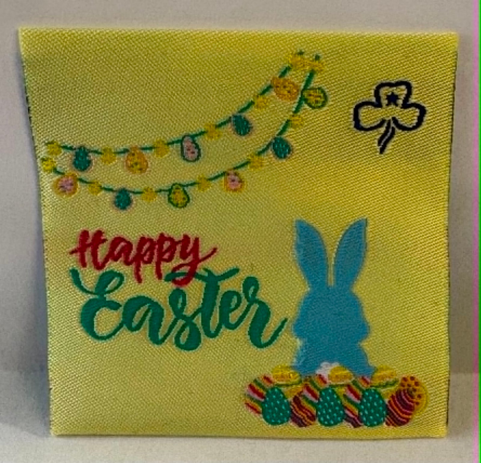 Square unbound badge with 'Happy Easter' text, bunny silhouette, and Easter eggs on a yellow background.