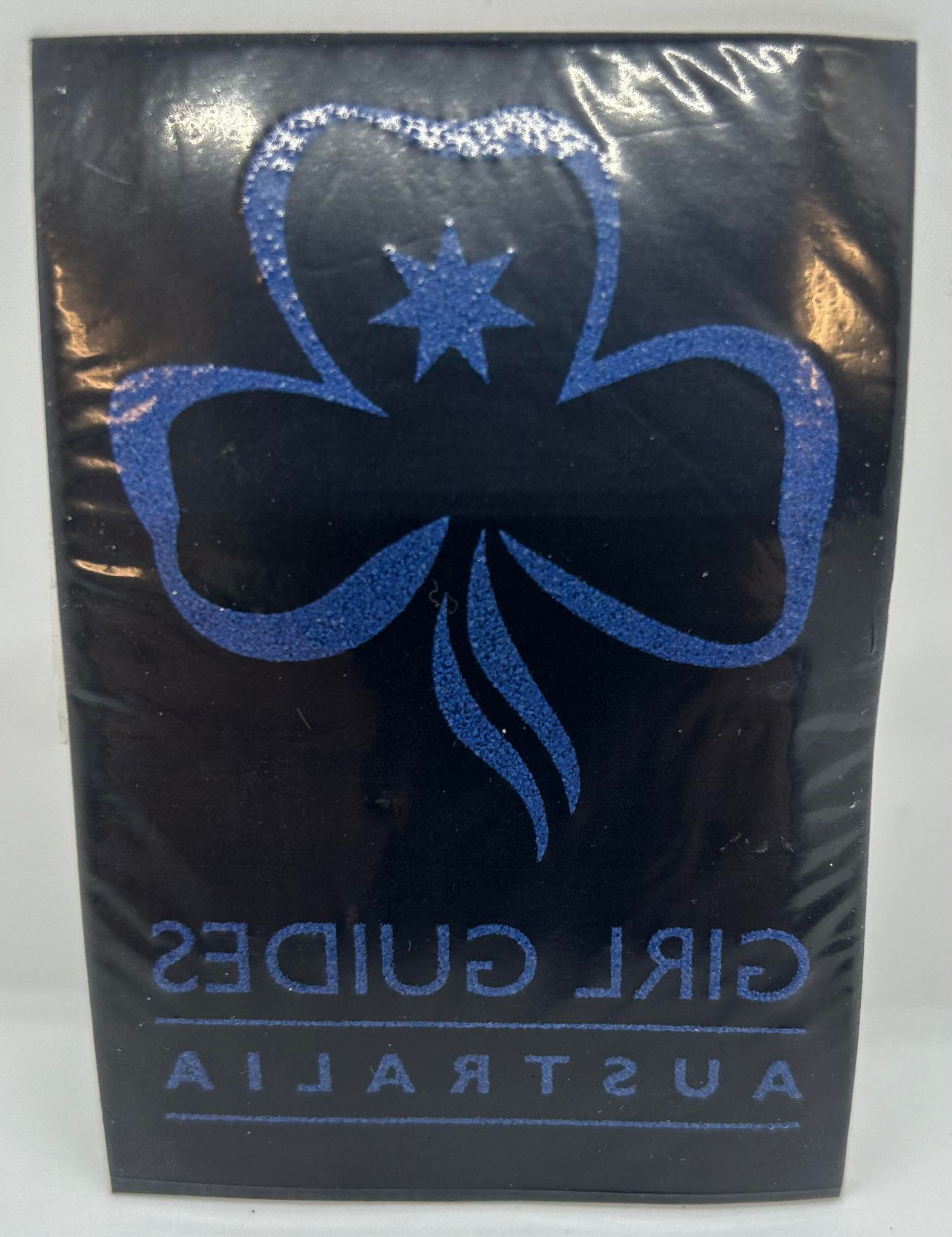 an iron on trefoil with girl guides Australia written underneath