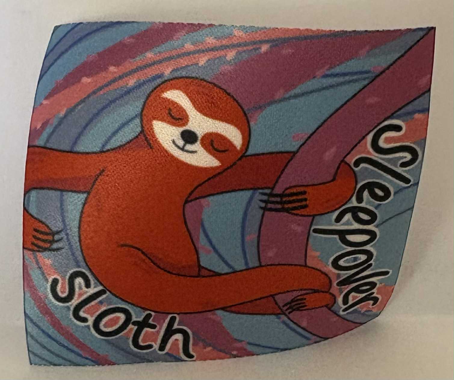 a square unbound badge with a sloth with the words sleepover sloth' with colourful background