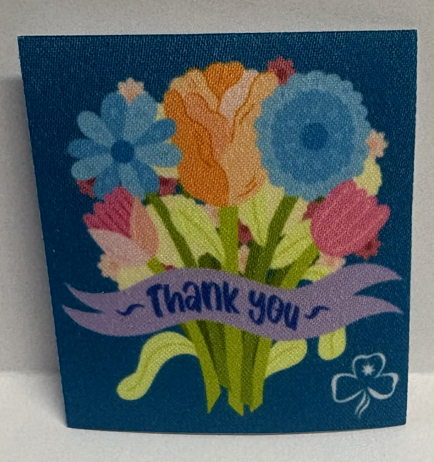 Square unbound badge with colorful flowers and 'Thank you' text on a blue background